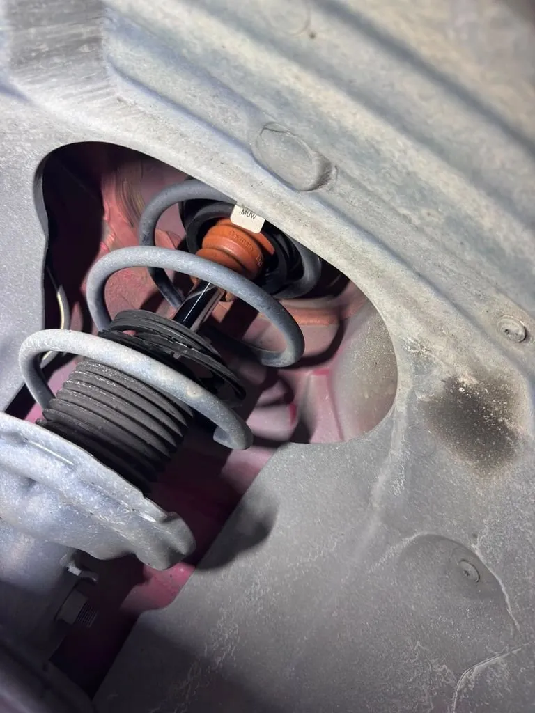 New shock absorber installed in Audi A3 rear wheel arch during suspension overhaul at our Singapore workshop