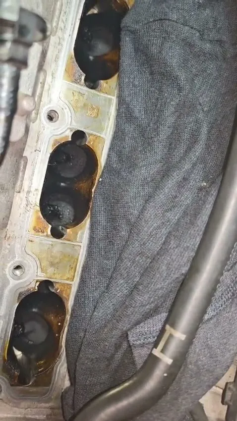 Audi A3 intake ports showing heavy carbon buildup before walnut blasting at 1 Car Service Workshop