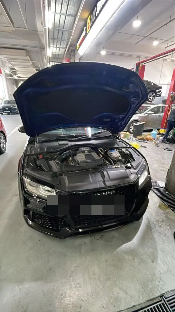 Audi A7 3.0 TFSI with bonnet open in our Singapore workshop bay during a Check Engine Light diagnosis