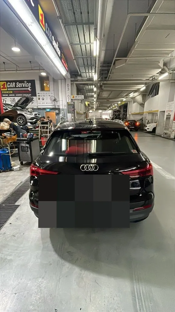 Black Audi Q3 in the workshop bay at our Singapore service centre