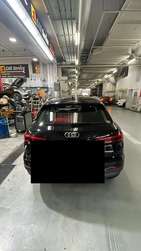 Black Audi Q3 in the workshop bay at our Singapore service centre