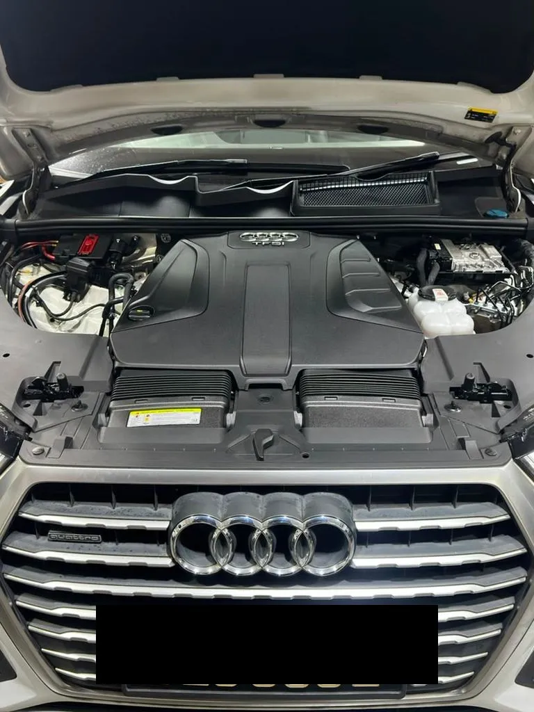 Silver Audi Q7 TFSI Quattro engine bay with the bonnet open at our Singapore workshop, showing the 3.0 TFSI engine