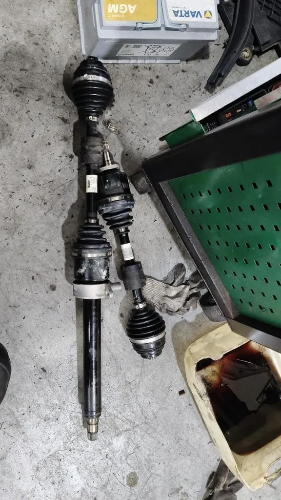 BMW 216 front driveshaft removed for inner boot and CV joint replacement at our Singapore workshop