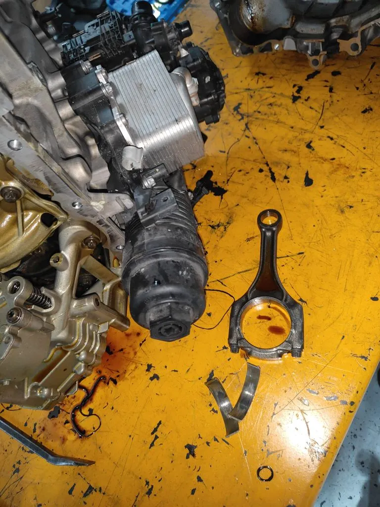 BMW 216i engine stripped during overhaul at 1 Car Service Workshop showing internal damage
