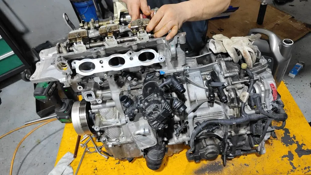 BMW 216i engine being reassembled during overhaul at 1 Car Service Workshop in Singapore