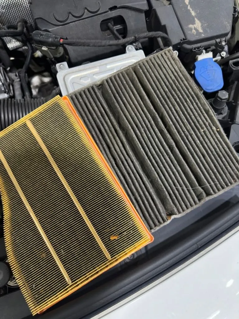 Dirty engine air filter and cabin filter removed from a BMW 3 Series during a major service inspection at our Singapore workshop
