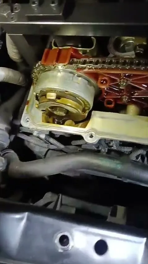 BMW 523i N52 timing chain and cam sprocket exposed during diagnosis