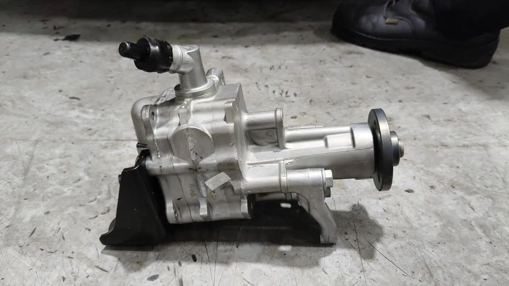 Power steering pump removed from a BMW 740Li during repairs at our Singapore workshop