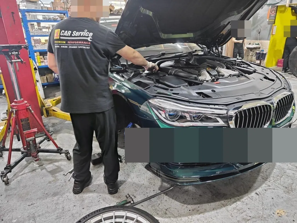 Our team working on the BMW Alpina B7 at our Sin Ming workshop