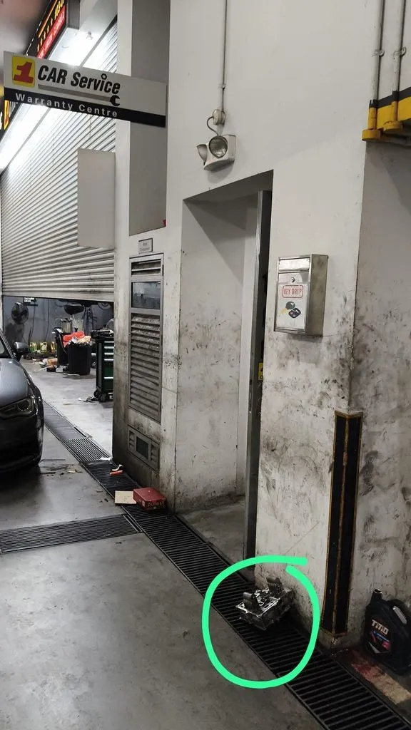 Blue BMW at 1 Car Service workshop in Singapore during multi-system fault repair
