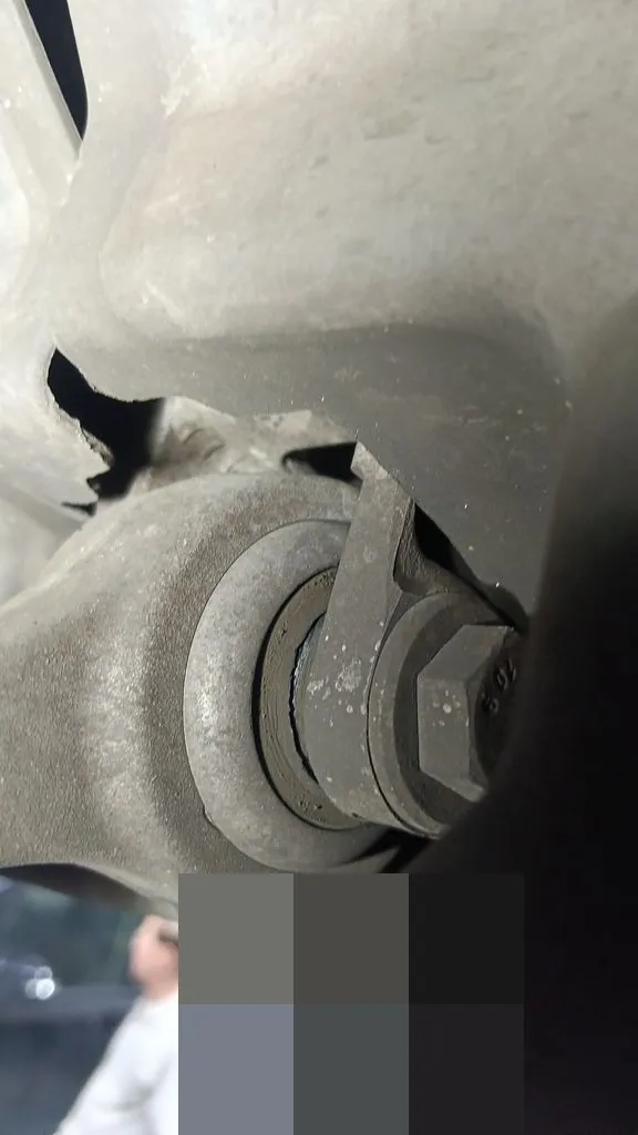 BMW front suspension control arm replacement in progress during repair at our Singapore workshop