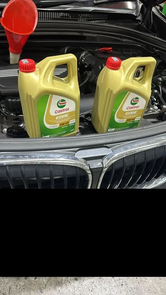 Castrol Edge 5W-40 engine oil ready in the engine bay of a BMW X1 during a service at our Singapore workshop