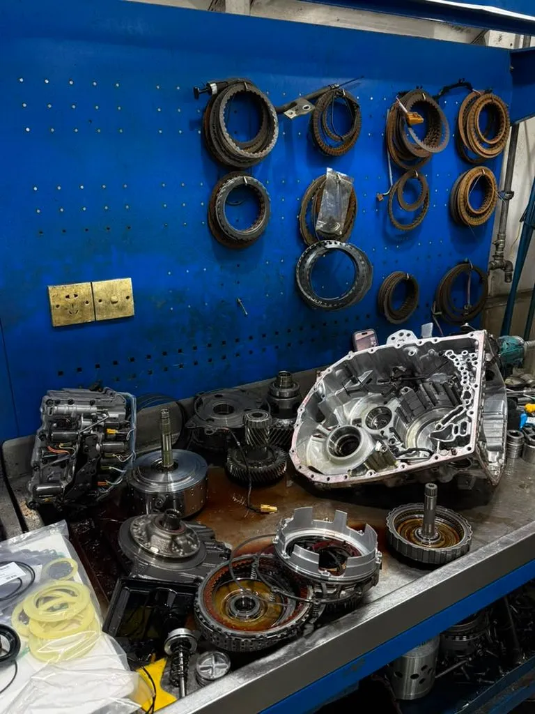 BMW X1 automatic gearbox and torque converter disassembled on the workshop bench during an overhaul in Singapore