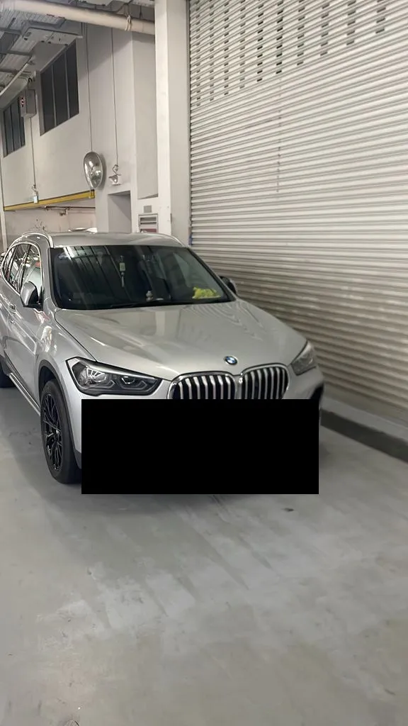 BMW X1 parked at our Sin Ming AutoCity workshop in Singapore before coolant leak repair