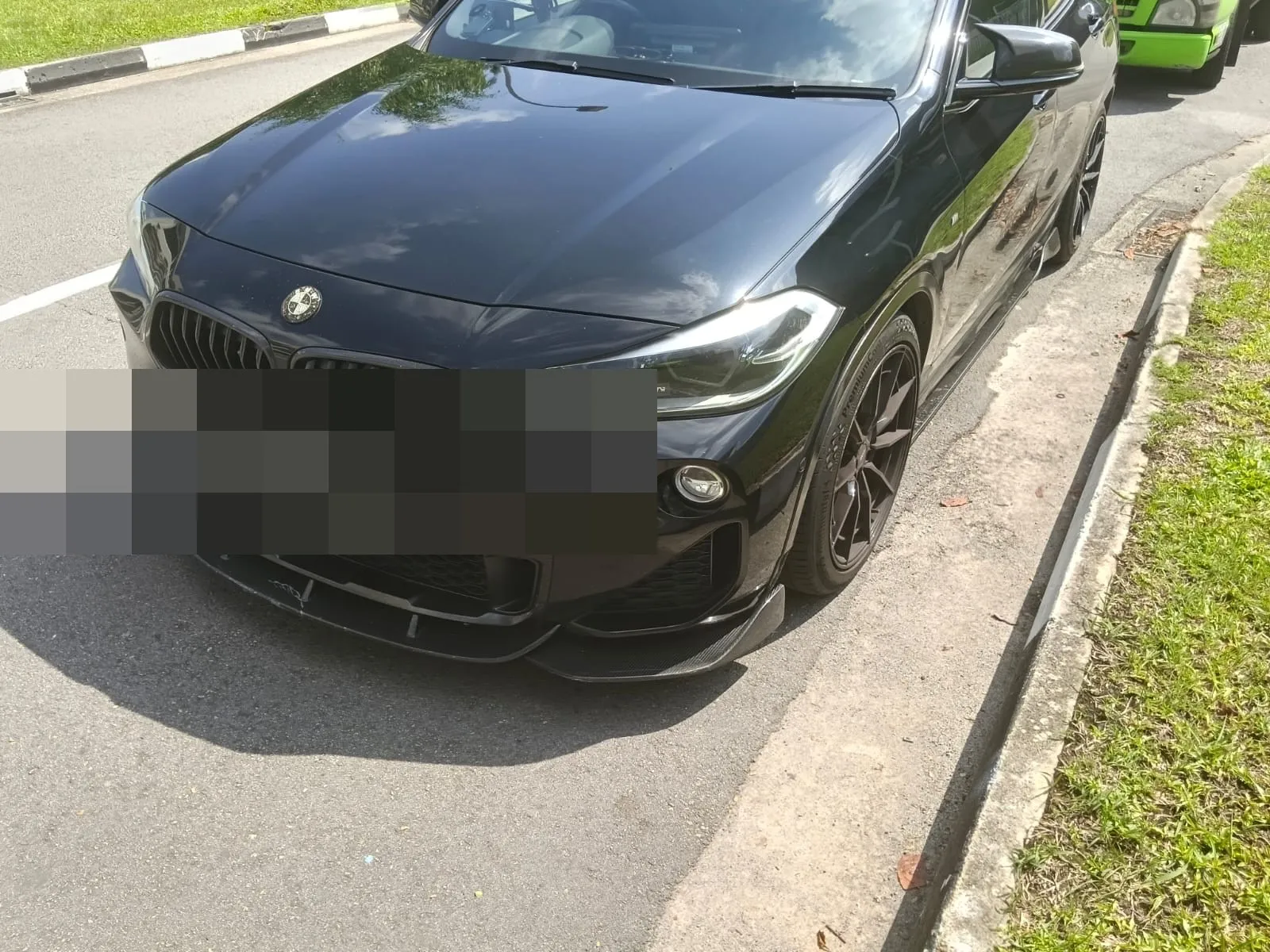 BMW X2 at the roadside before servicing at our Singapore workshop.