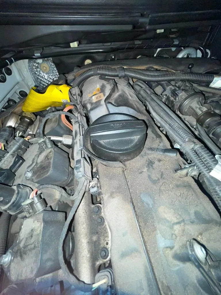 BMW X4 engine bay open, valve cover visible and timing system components accessible at our Singapore workshop