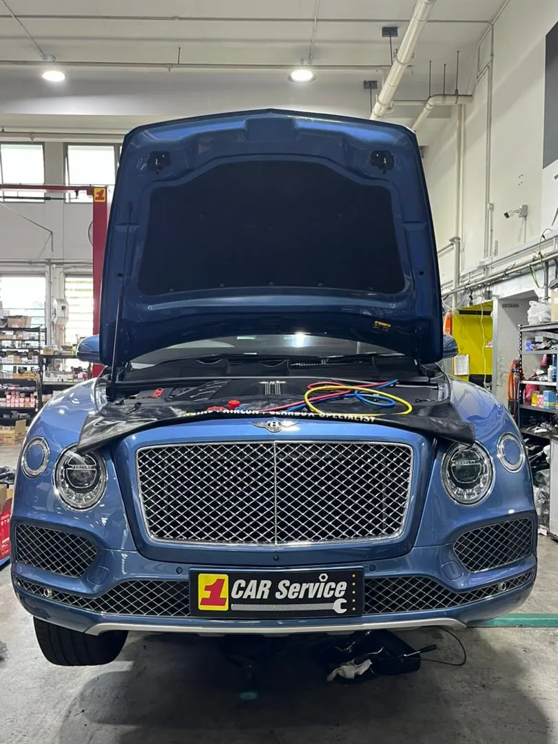 Aircon gas recharge on a car at our Singapore workshop