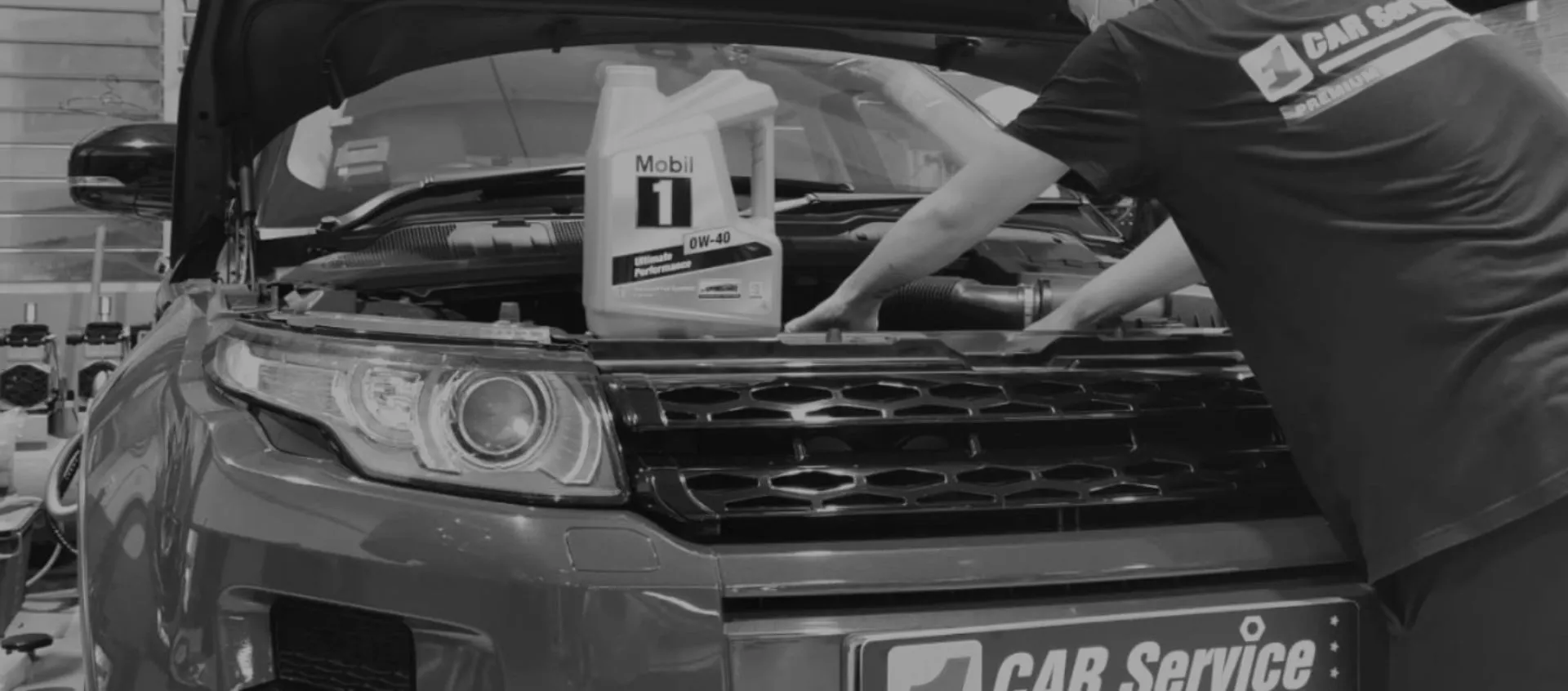 Technician doing an oil and filter service on a continental car at our Singapore workshop