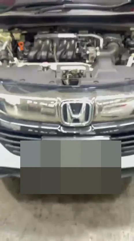 Honda Freed with bonnet open at our Singapore workshop during major service inspection