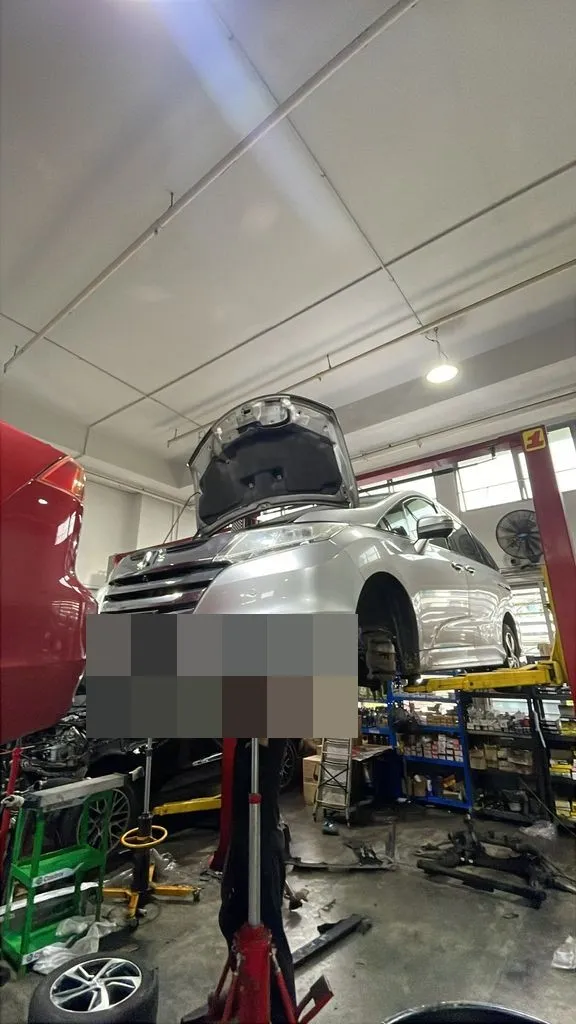 Honda Odyssey raised on a workshop lift for oil seal replacement at our Singapore workshop