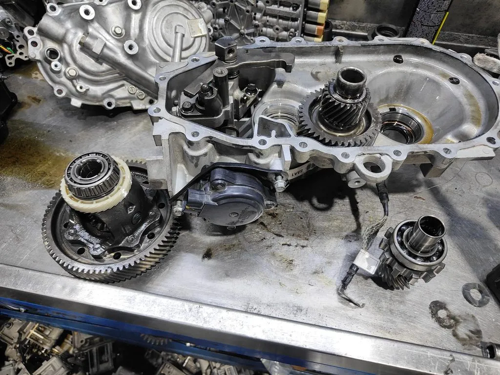Hyundai Ioniq Electric reduction gearbox disassembled on the workshop bench during an EV gearbox overhaul in Singapore