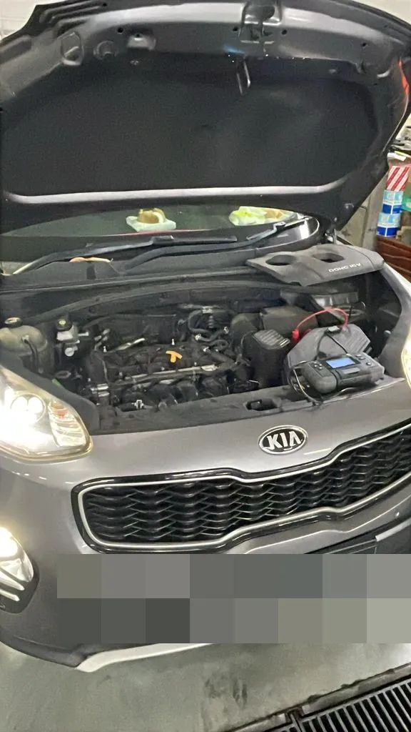 Kia Sportage with engine bay open at our Singapore workshop during a major service