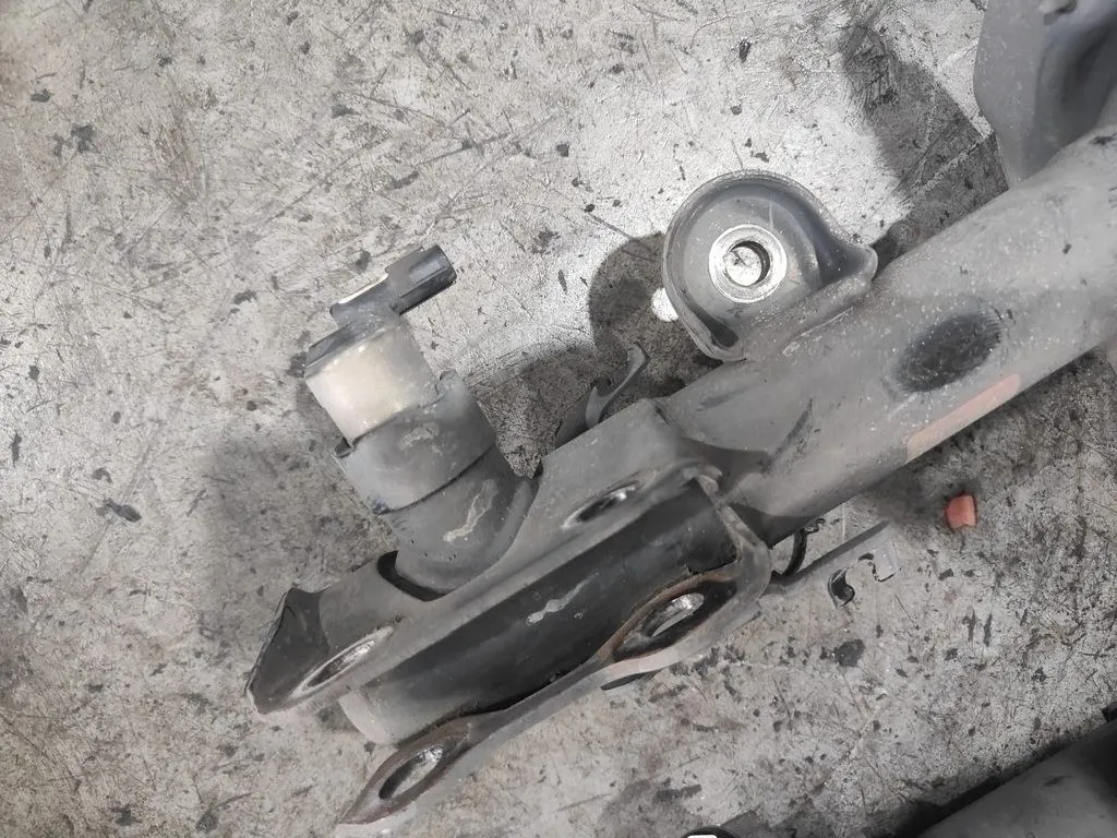 Old Lexus IS F-Sport suspension lower arm showing severely deteriorated and cracked rubber bushings at 1 Car Service Singapore