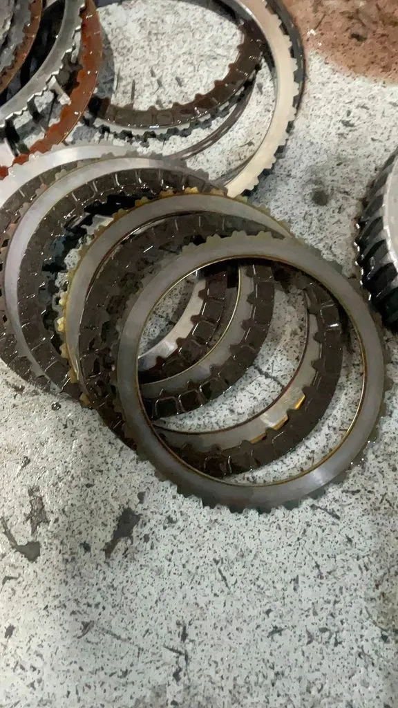 Burnt automatic gearbox clutch plates removed from a Mazda 3 at our Singapore workshop