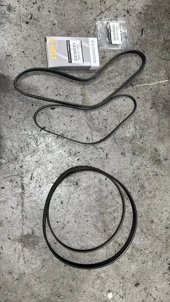 New original Mazda drive belts in Mazda-branded packaging ready for installation at our Singapore workshop