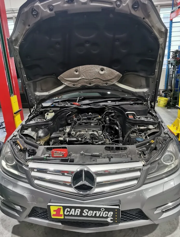Mercedes C-Class engine bay open during repair at our Singapore workshop