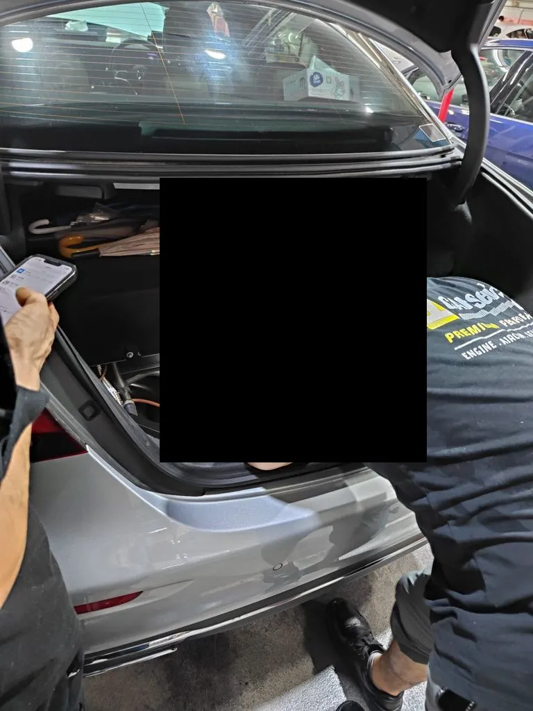 Mercedes E350e boot floor open during on-board charger control unit replacement at our Singapore workshop