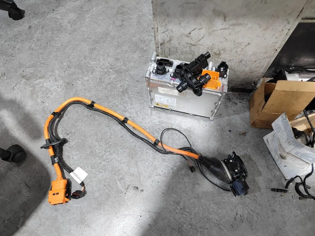 Mercedes-Benz E350e on-board charger control unit and high-voltage cables, removed for replacement at 1 Car Service Singapore