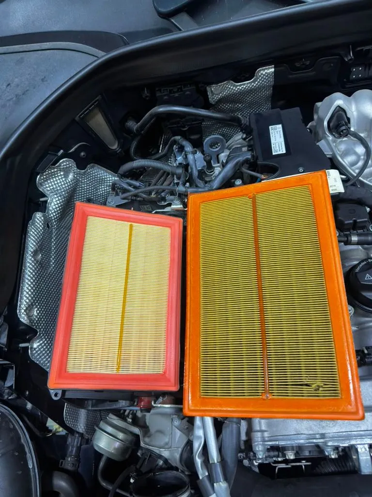 Old and new air filters from a Mercedes GLC during a major service at our Singapore workshop