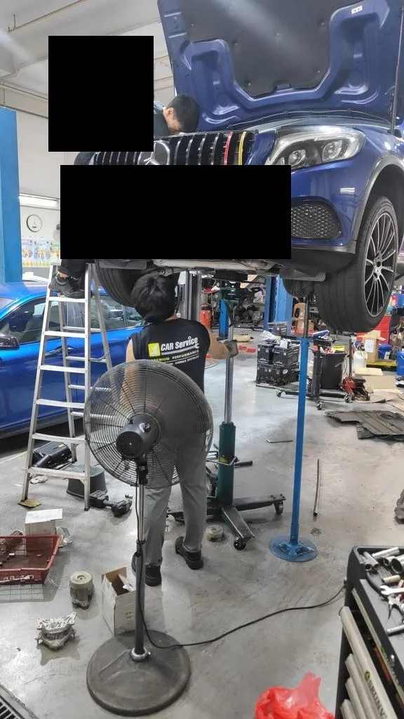 Blue Mercedes GLC W253 on the workshop lift at 1 Car Service Singapore with engine mount replacement in progress