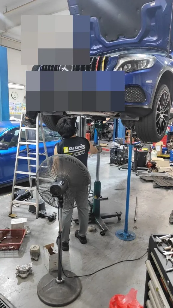 Blue Mercedes GLC W253 on the workshop lift at 1 Car Service Singapore with engine mount replacement in progress