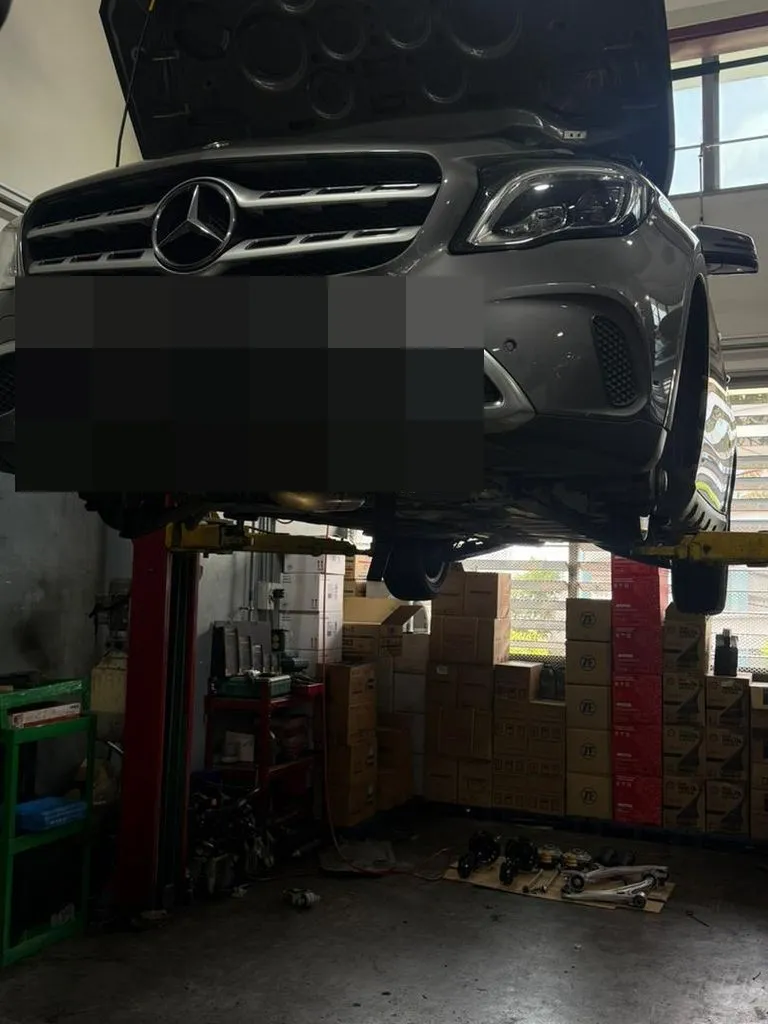 Mercedes-Benz on the lift at our Singapore workshop during front suspension inspection