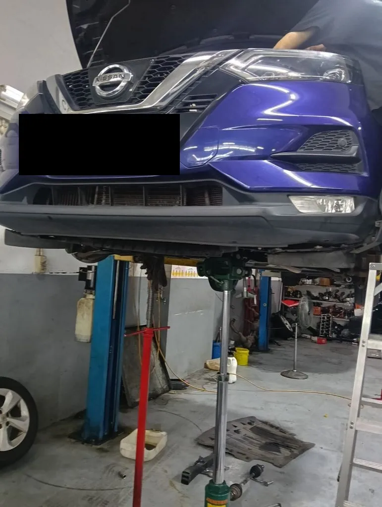 Nissan Qashqai raised on the lift for an automatic gearbox overhaul at our Singapore workshop