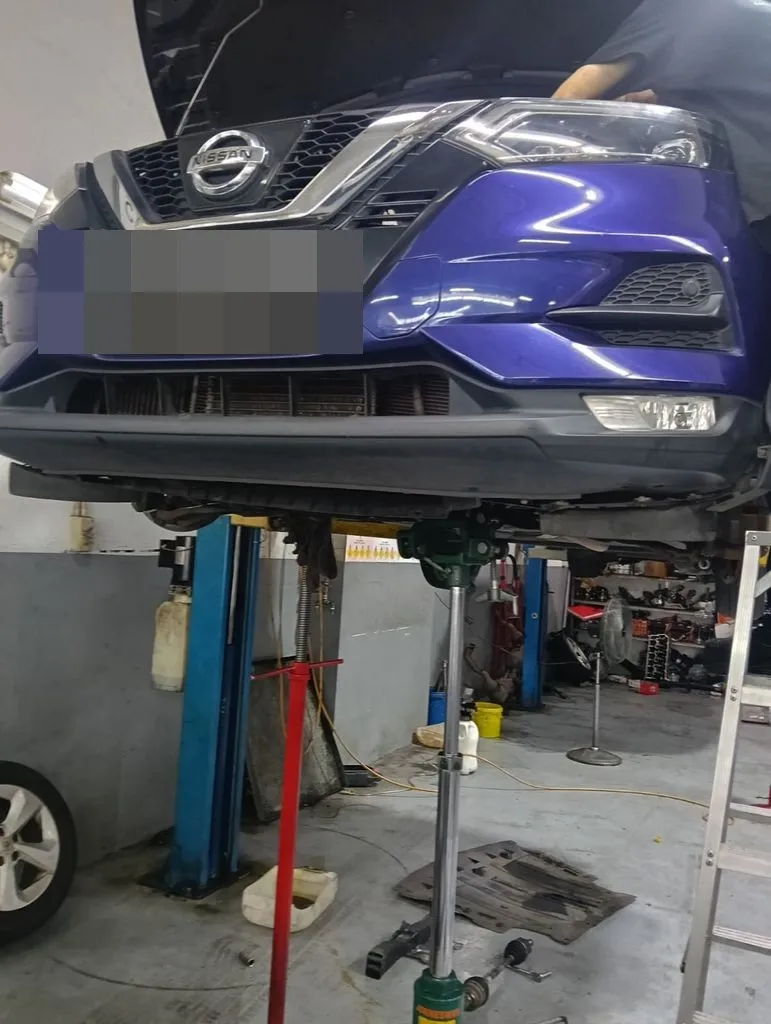 Nissan Qashqai raised on the lift for an automatic gearbox overhaul at our Singapore workshop