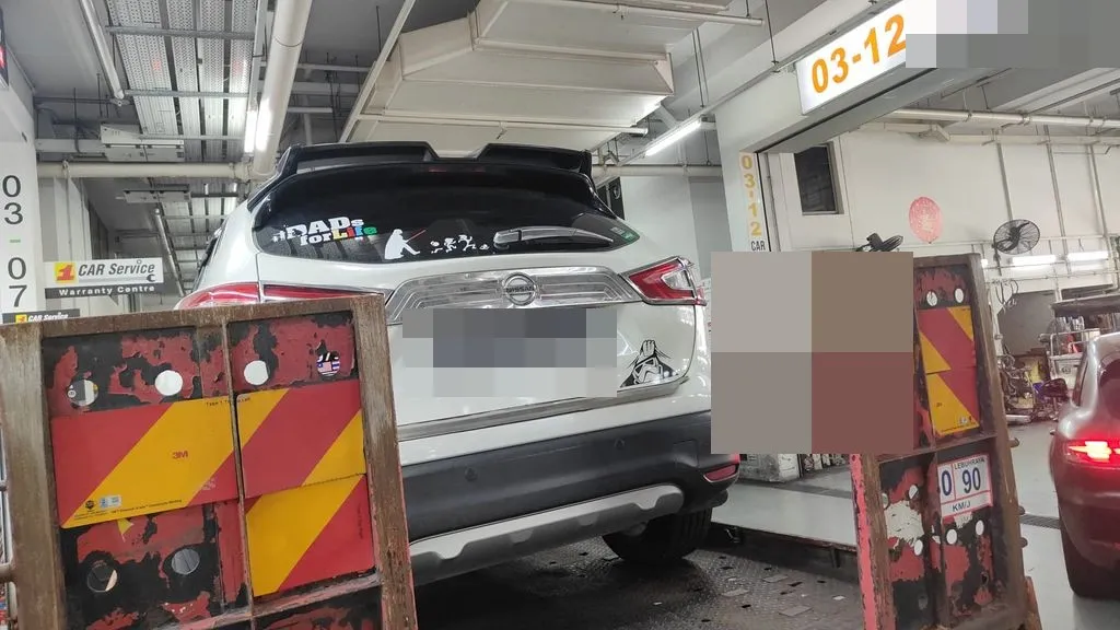 White Nissan Qashqai SUV arriving for engine repair at our Sin Ming workshop in Singapore