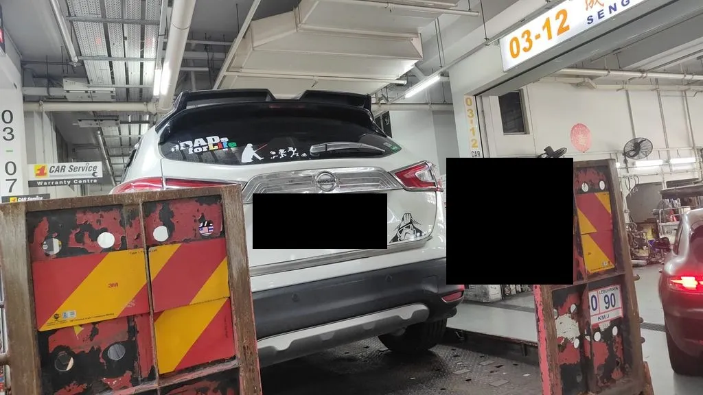 White Nissan Qashqai SUV arriving for engine repair at our Sin Ming workshop in Singapore