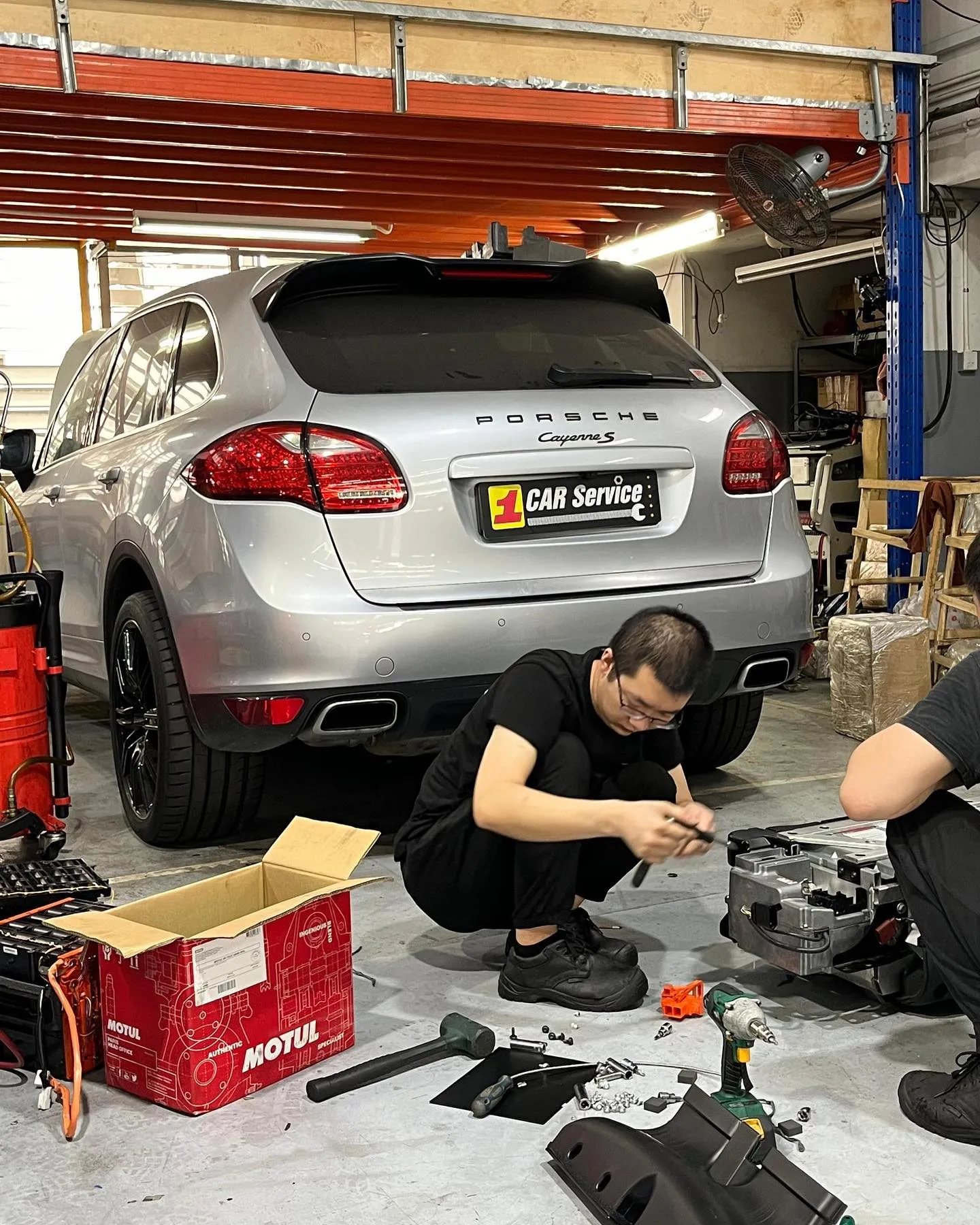 A Porsche Cayenne in for air suspension repair at our Sin Ming workshop in Singapore