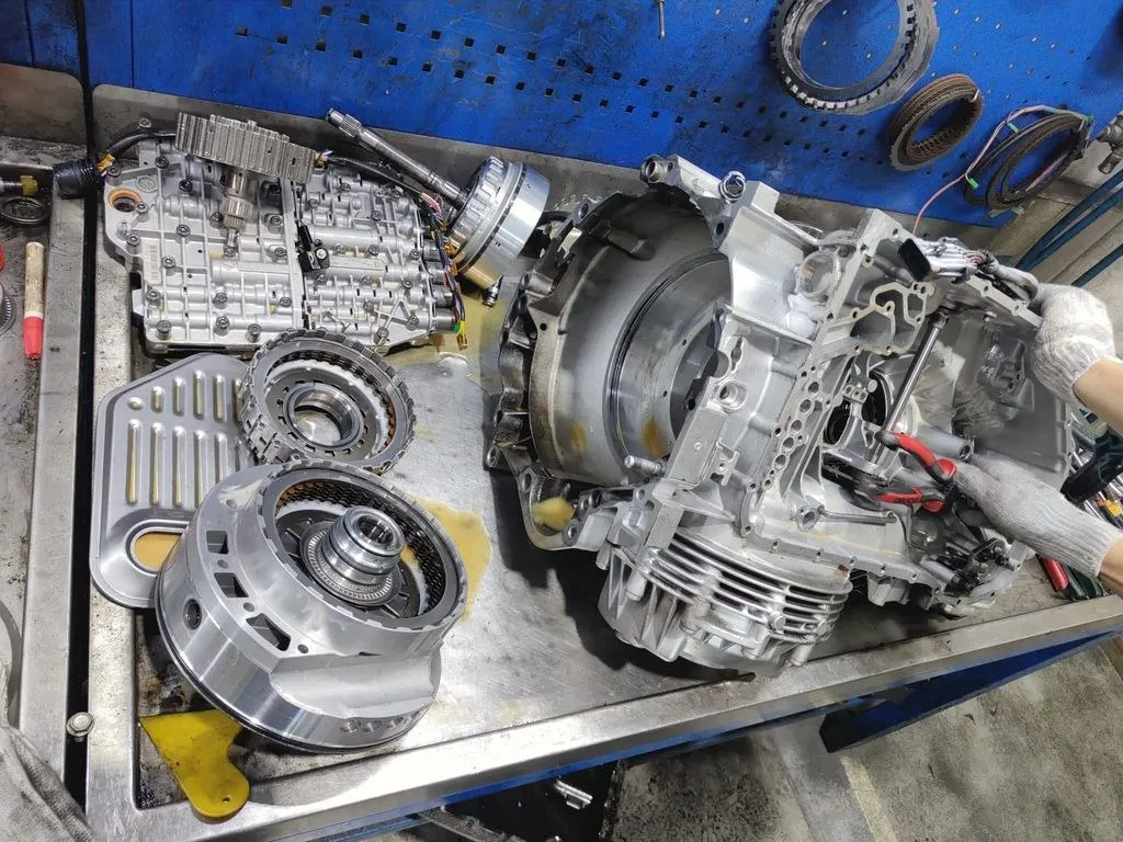 Porsche Cayman Tiptronic gearbox fully disassembled on the workbench during an overhaul at our Singapore workshop