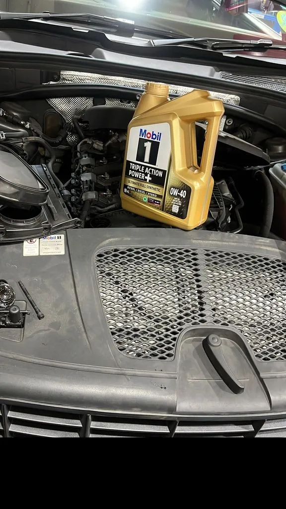 Fresh Mobil 1 fully synthetic engine oil during a Porsche Macan oil leak repair and service