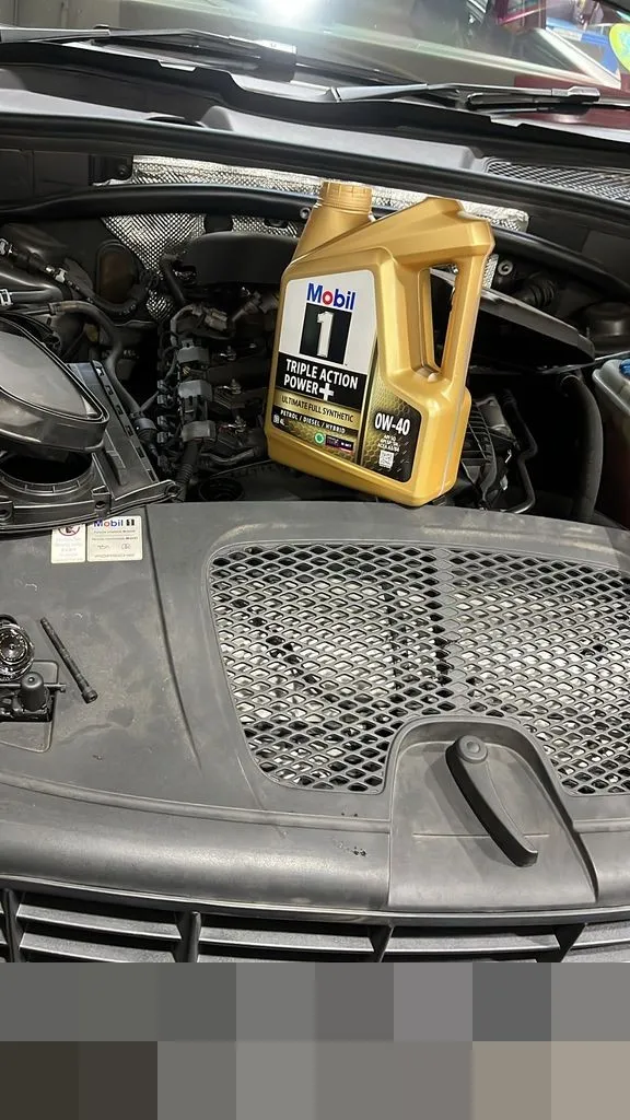 Fresh Mobil 1 fully synthetic engine oil during a Porsche Macan oil leak repair and service