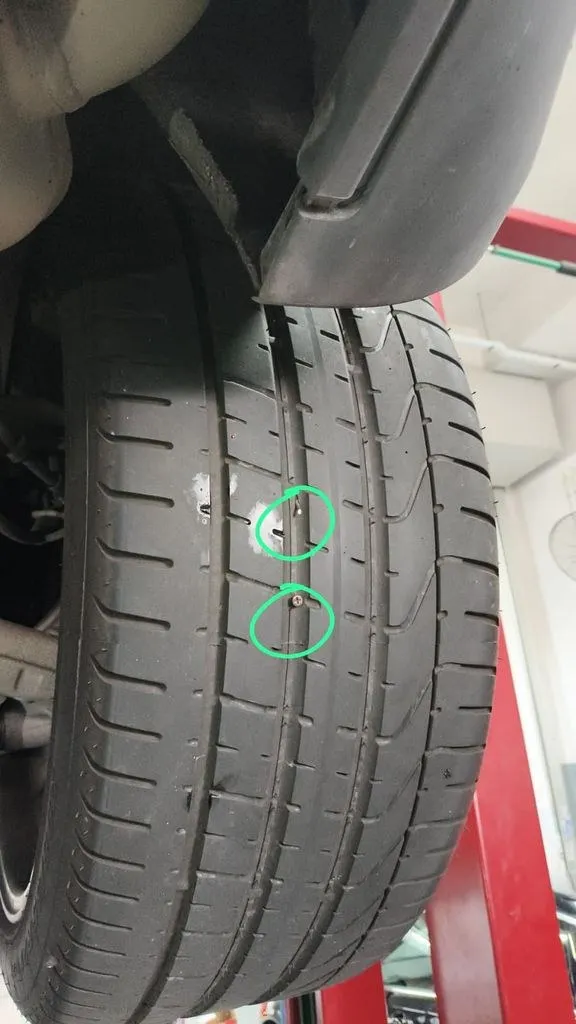 Tyre puncture from nails identified and patched during the Porsche Macan visit