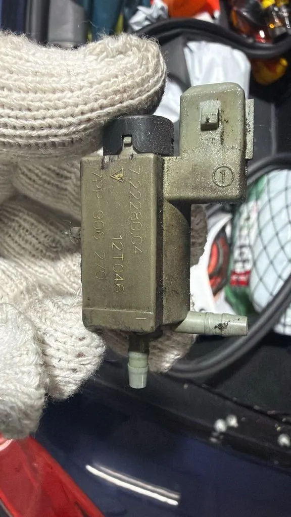 Coolant changeover valve removed from a Porsche PDK heat exchanger circuit during diagnosis in Singapore