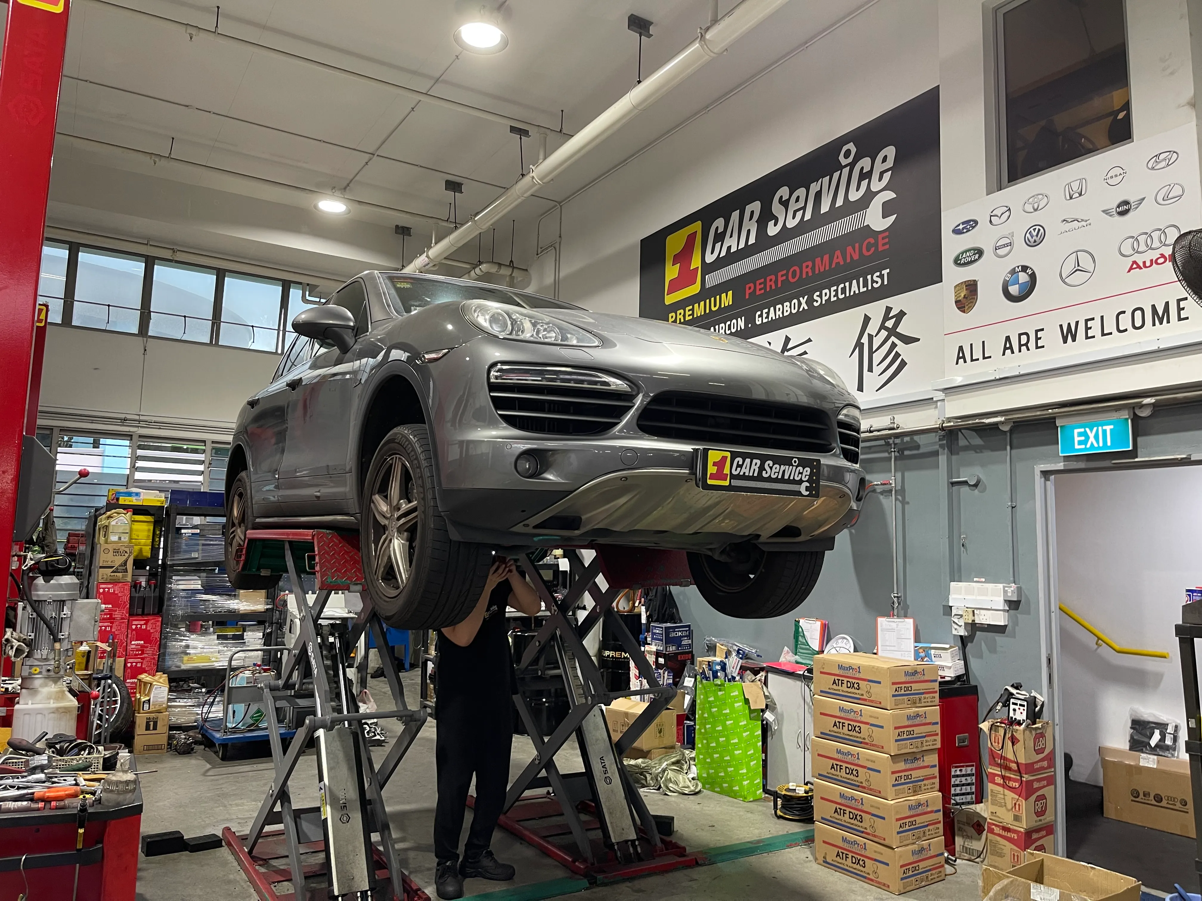 Porsche on the lift for servicing at our Singapore workshop