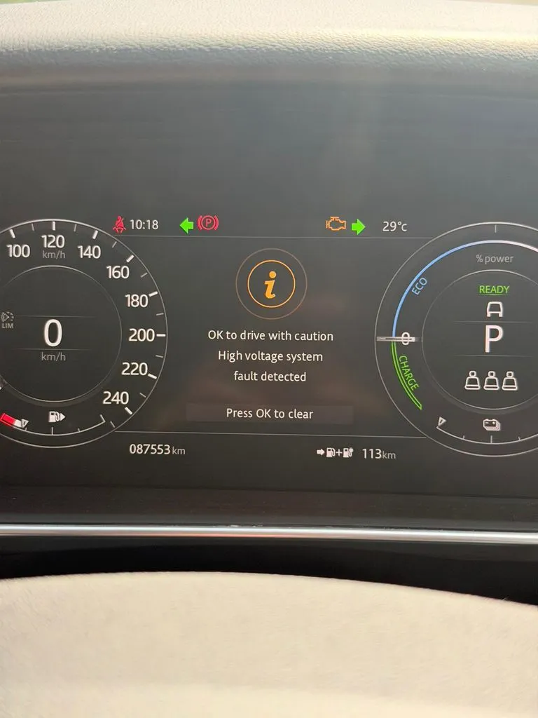 Range Rover Sport PHEV dashboard showing a high-voltage system fault warning in Singapore