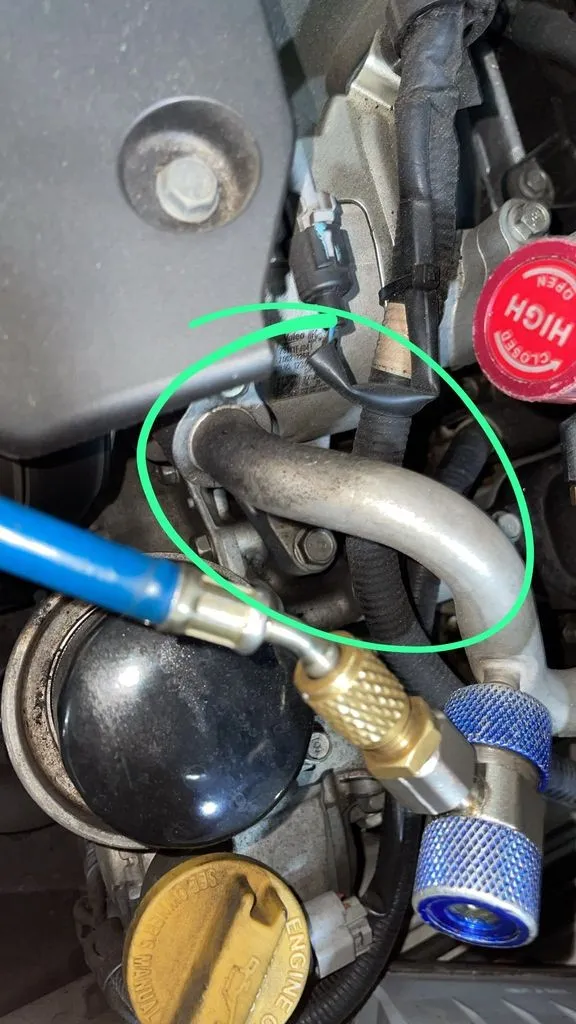 Subaru Forester A/C discharge pipe showing wear at the fitting before replacement in Singapore
