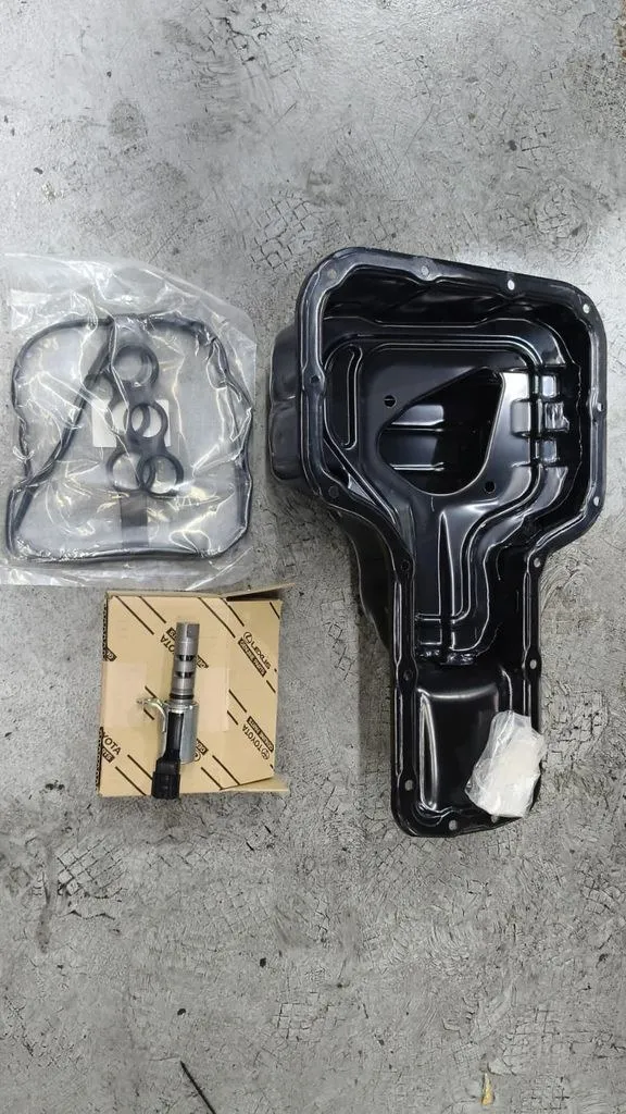 New OEM-grade gearbox and engine parts laid out for a Toyota Corolla Altis repair in Singapore